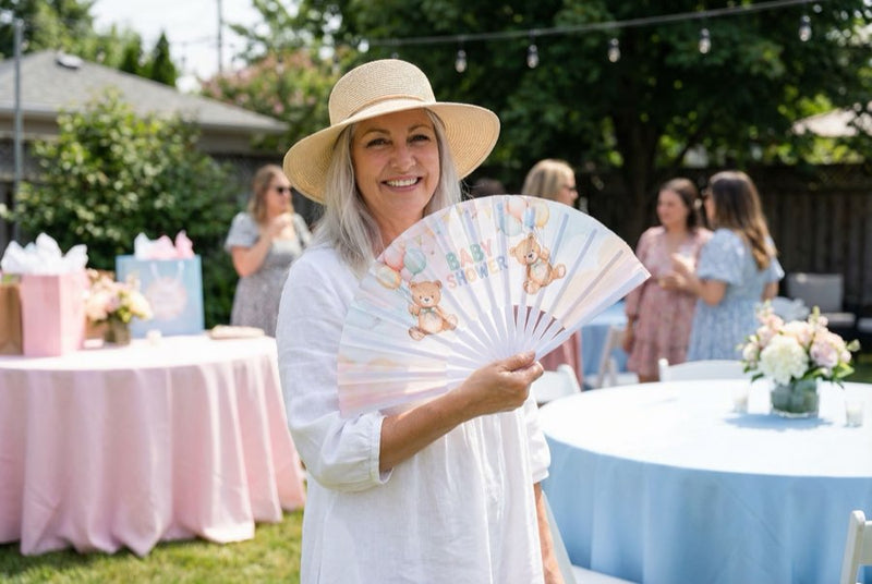 Guests holding custom printed hand fans