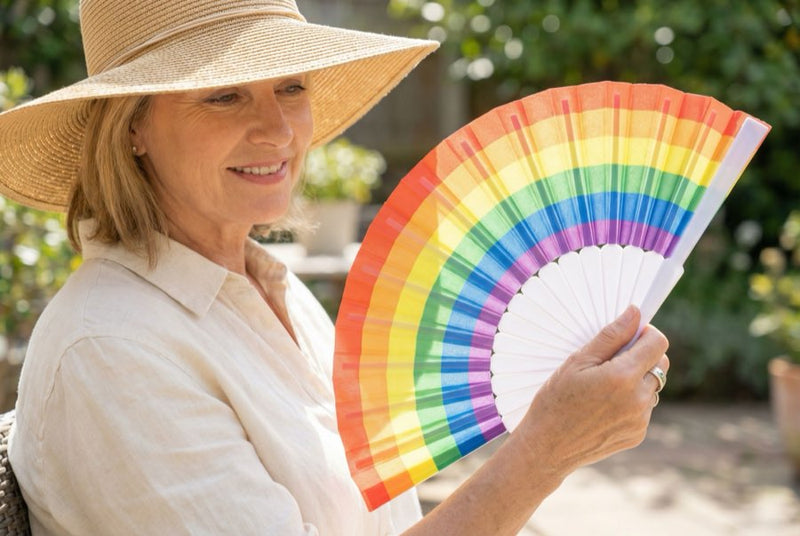 Guests holding custom printed hand fans