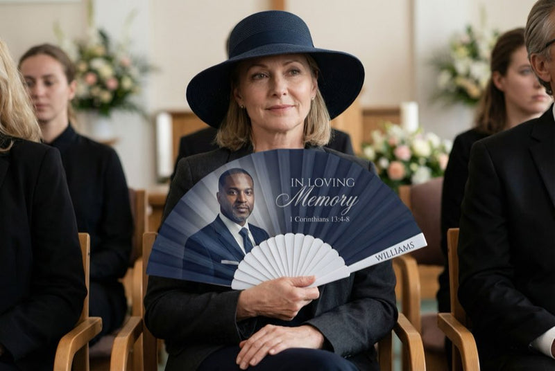 Guests holding custom printed hand fans