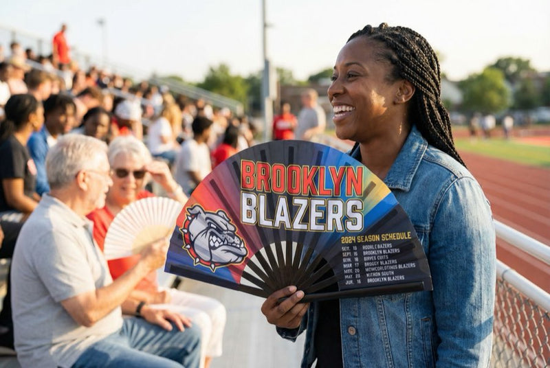 Custom bamboo fans in use — Custom Fans for Sports Teams