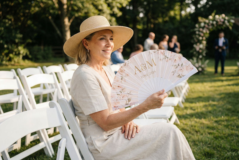 Guests holding custom printed hand fans